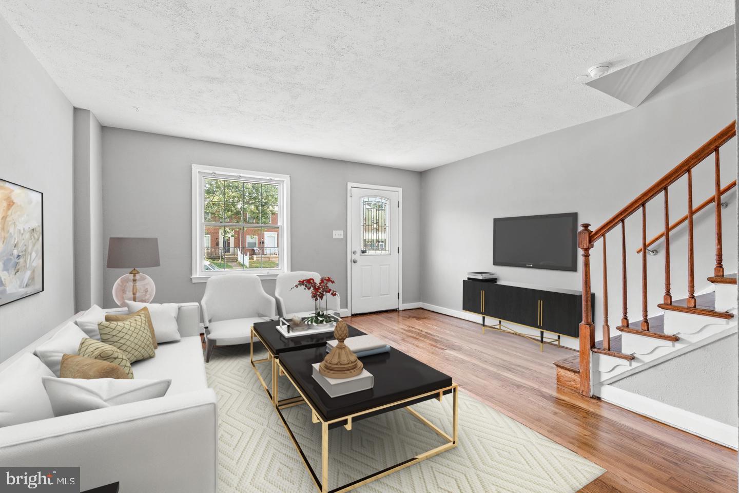 2214 Hawthorne Road Baltimore, MD 21220 - Photo 2 of 28 a living room with furniture and a fireplace