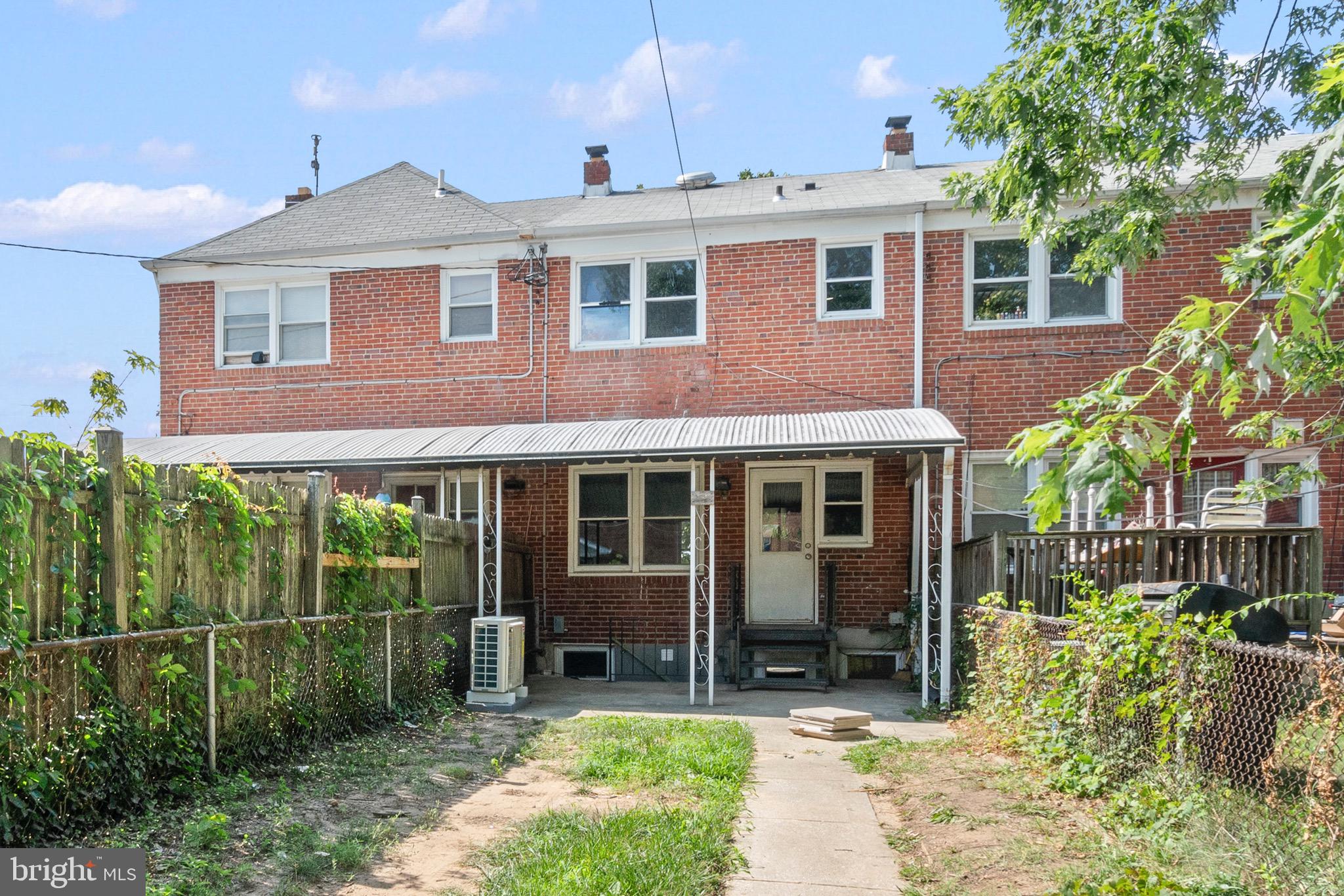 2214 Hawthorne Road Baltimore, MD 21220 - Photo 25 of 28 a front view of a house with garden