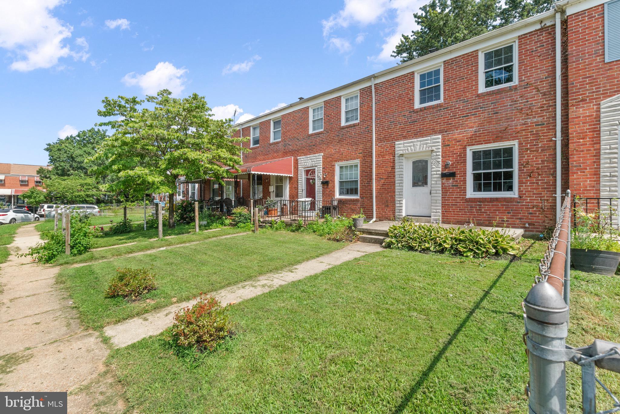2214 Hawthorne Road Baltimore, MD 21220 - Photo 28 of 28 a front view of a house with a yard and trees