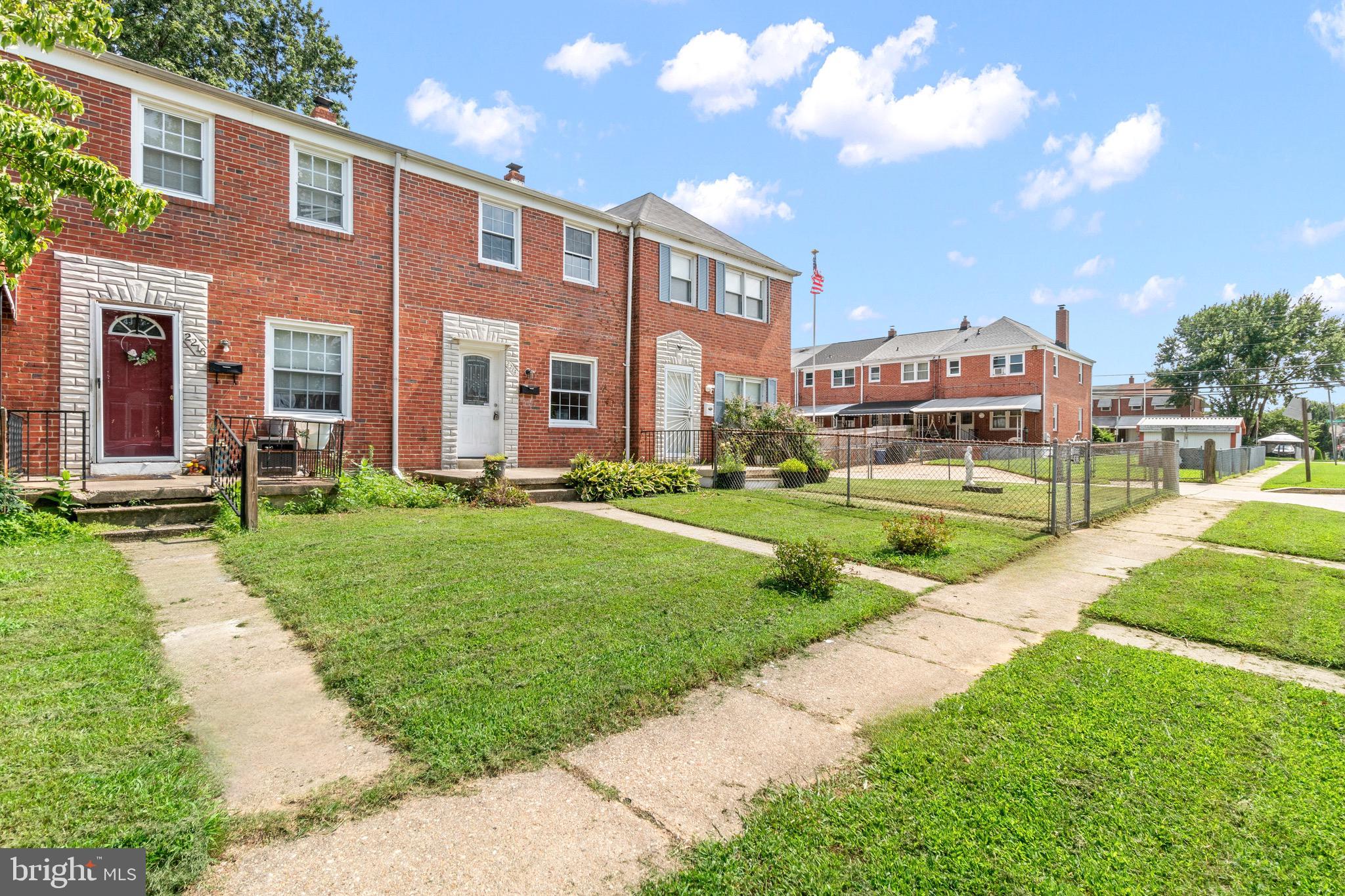2214 Hawthorne Road Baltimore, MD 21220 - Photo 7 of 28 a view of a big building with a big yard and plants