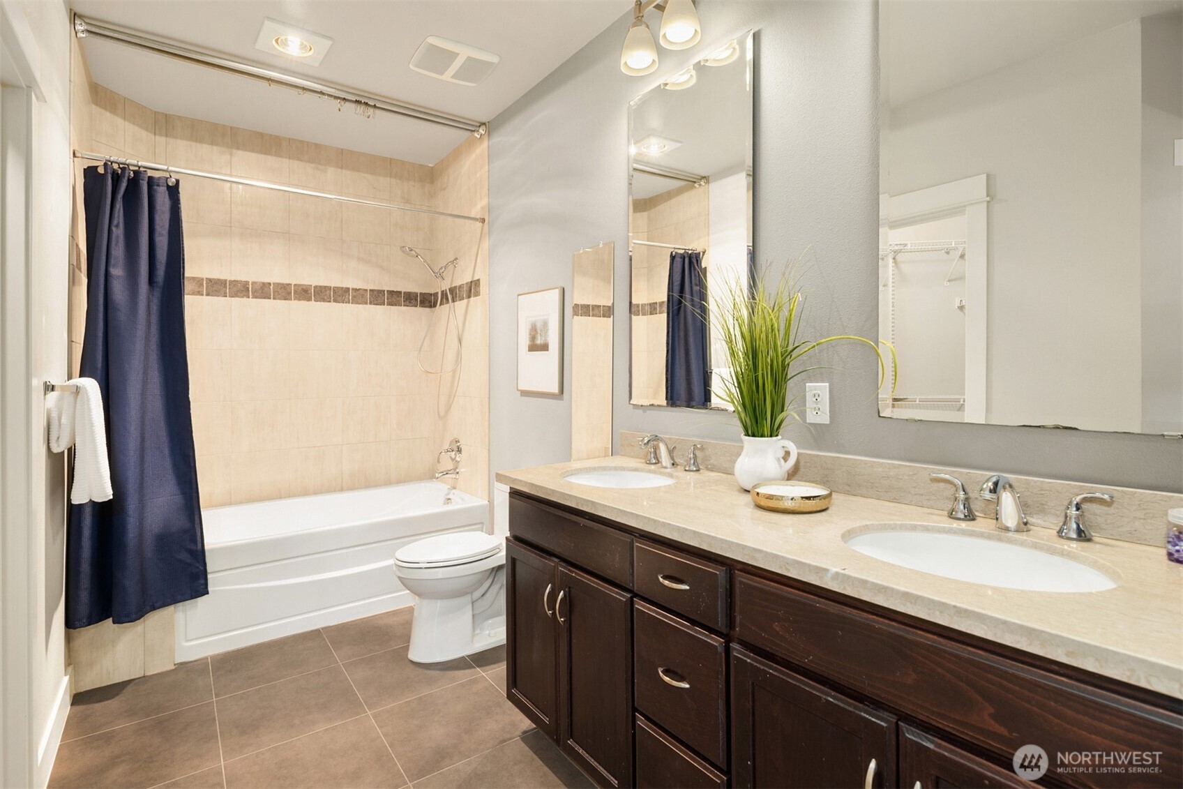 15700 116th Avenue Northeast, Unit 404 Bothell, WA 98011 - Photo 22 of 31 a bathroom with a granite countertop sink toilet and shower