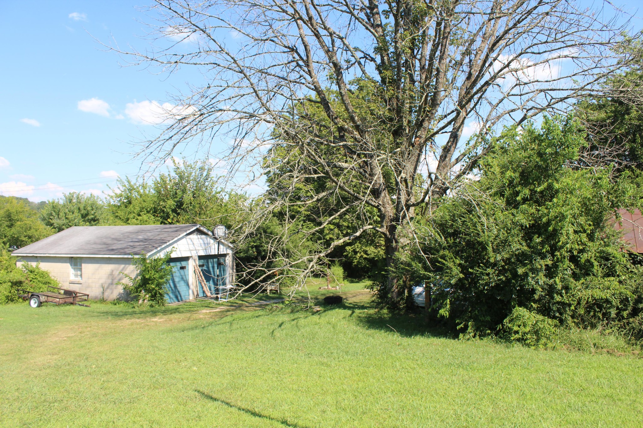 10121 Rutledge Pike Corryton, TN 37721 - Photo 9 of 11 a backyard of a house with yard and trampoline