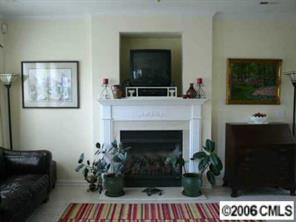 2341 Mirage Place Fort Mill, SC 29708 - Photo 2 of 8 a living room with furniture a flat screen tv and a fireplace