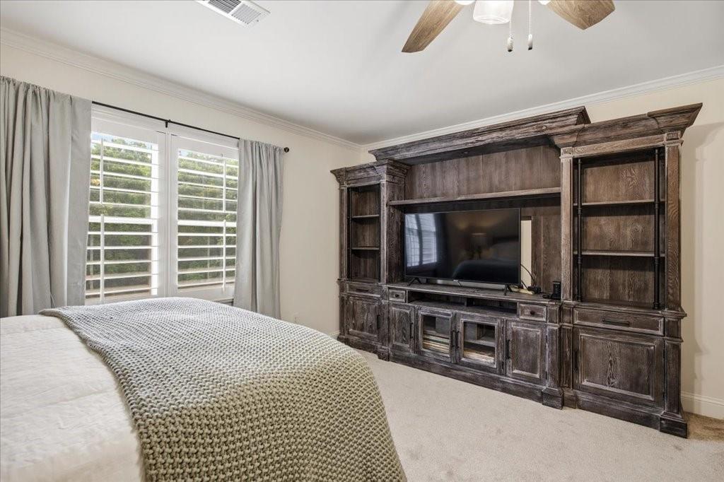 397 Thomas Road Dallas, GA 30132 - Photo 52 of 108 a bedroom with a bed and a flat screen tv
