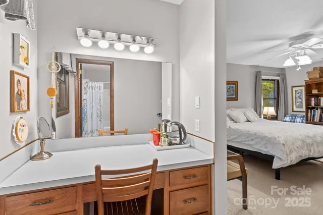 a bedroom with a bed and a dresser