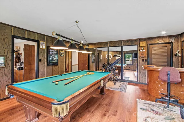 a room with pool table table tennis equipment