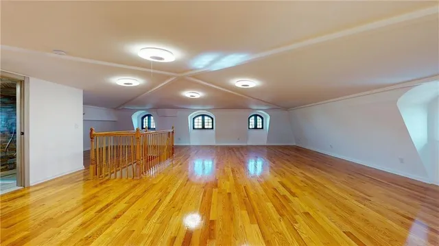 a view of a room with wooden floor