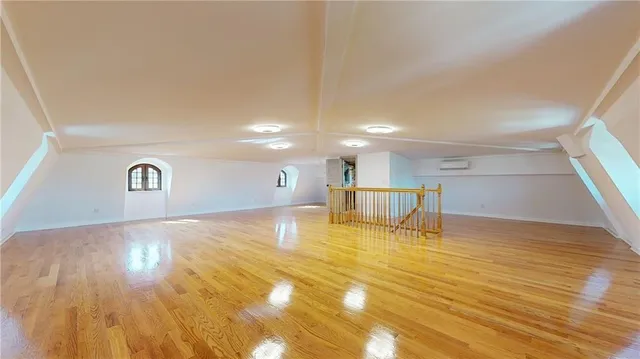 a view of a room with wooden floor