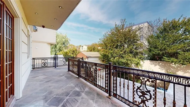 a view of a balcony with wooden floor