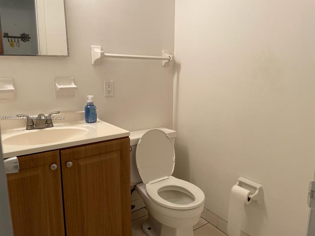 Garden Isles Pompano Beach, FL 33060 - Photo 2 of 9 a bathroom with a sink and a toilet