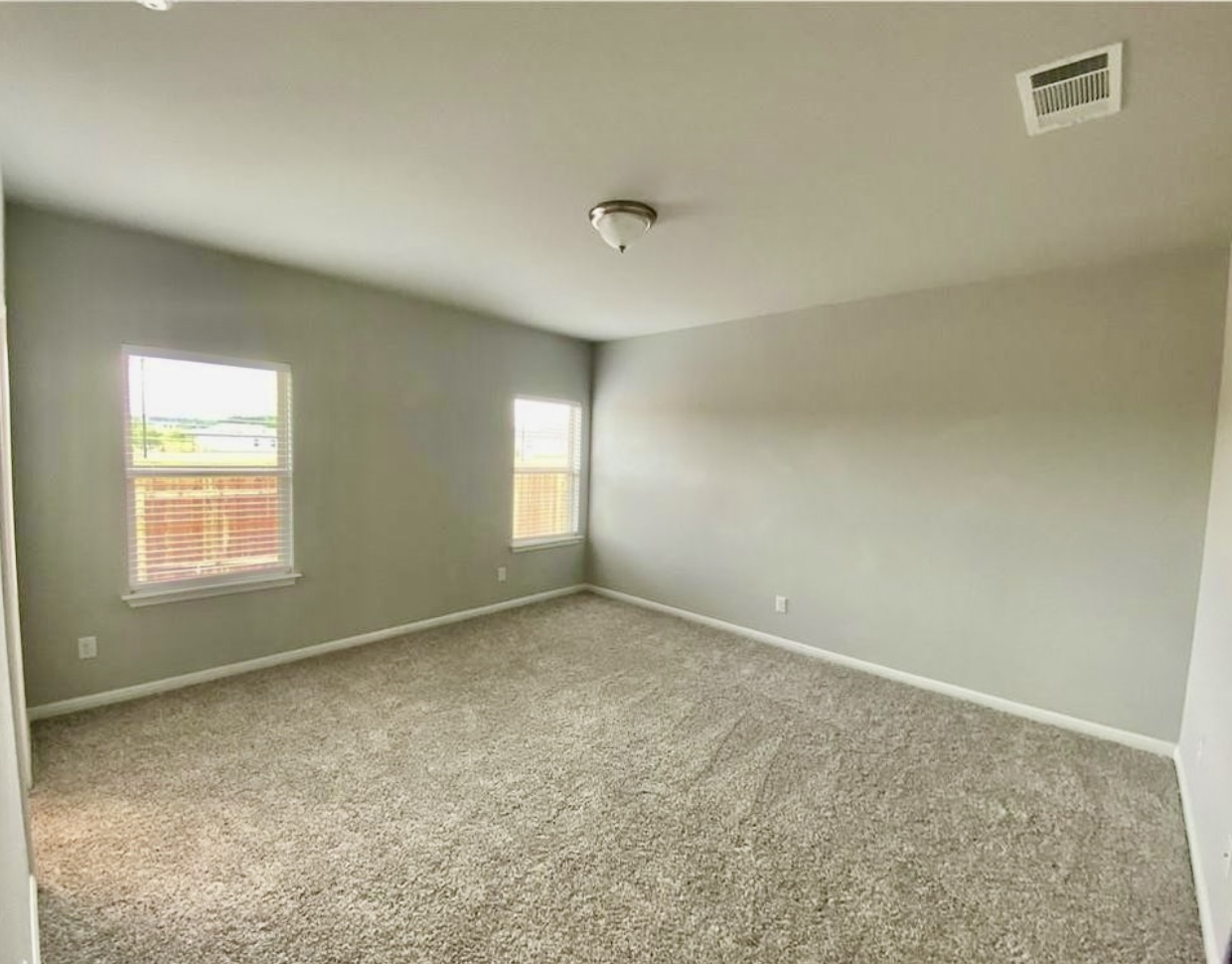 119 Wild Wind Cove Jarrell, TX 76537 - Photo 6 of 16 Unfurnished room with carpet floors and baseboards