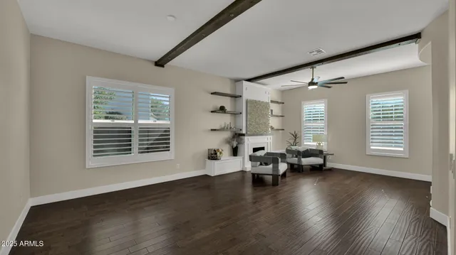 wooden floor with a bench in a room