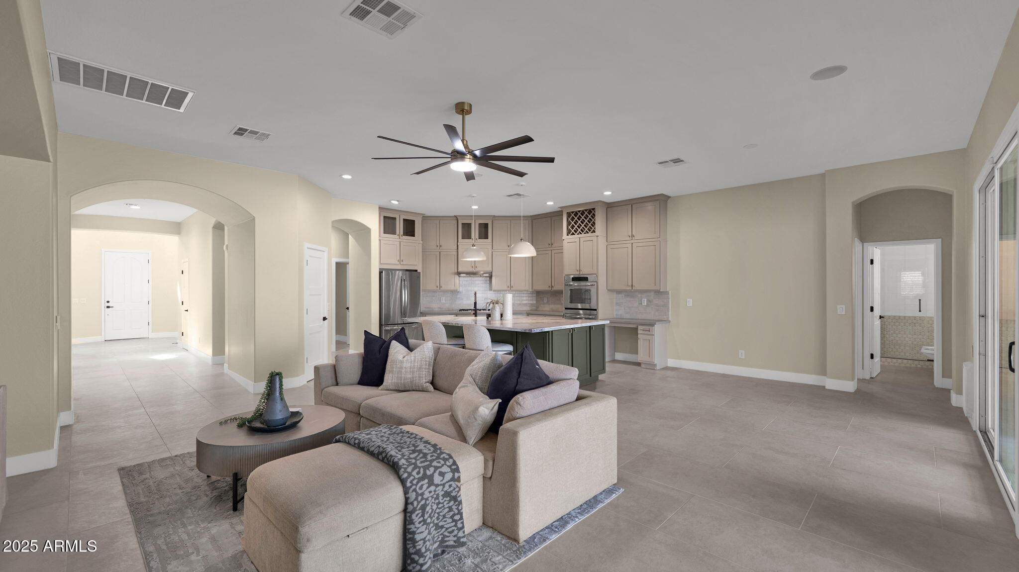 4060 East Canyon Way Chandler, AZ 85249 - Photo 15 of 55 a living room with furniture a window and a chandelier