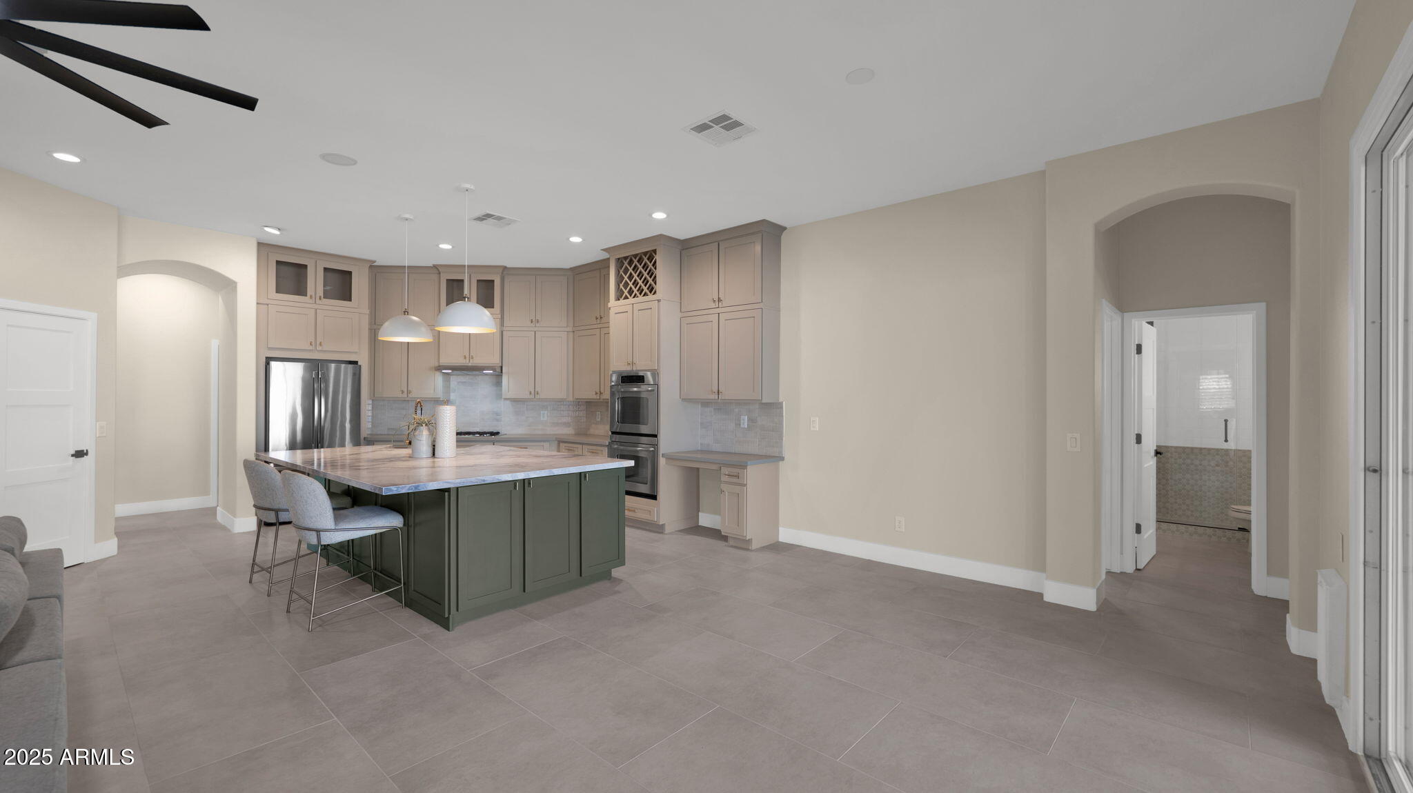 4060 East Canyon Way Chandler, AZ 85249 - Photo 16 of 55 a kitchen with kitchen island a sink stainless steel appliances and cabinets