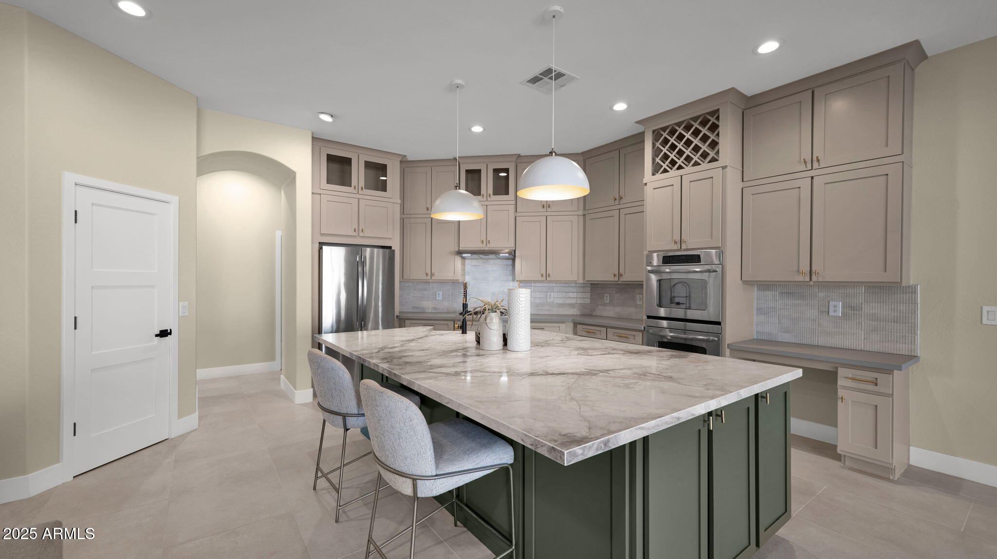 4060 East Canyon Way Chandler, AZ 85249 - Photo 17 of 55 a kitchen with center island table and chairs