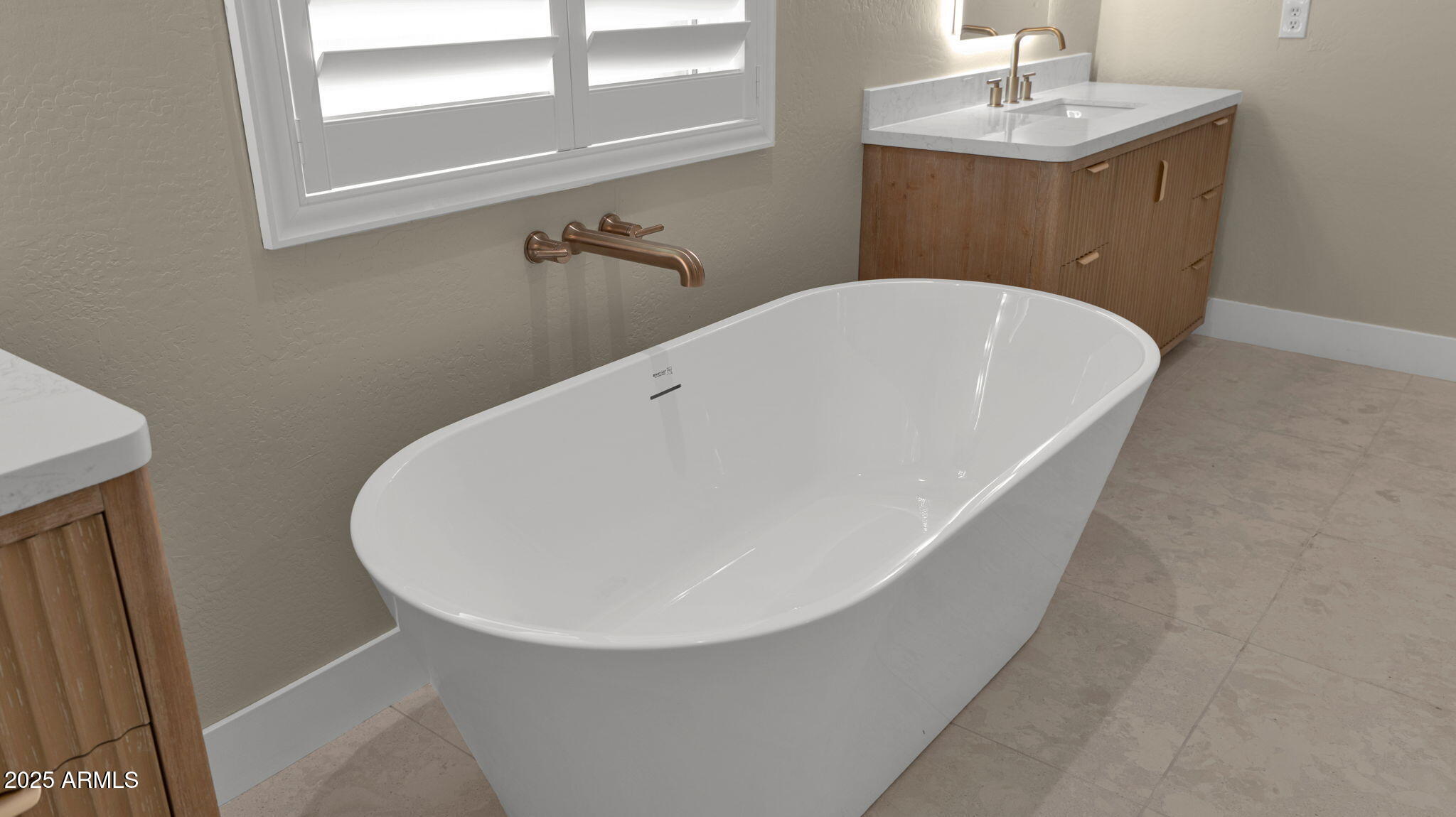 4060 East Canyon Way Chandler, AZ 85249 - Photo 30 of 55 a white bath tub sitting in a bathroom