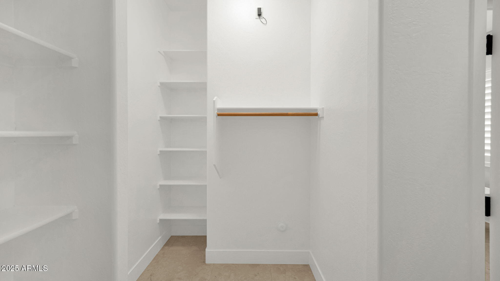 4060 East Canyon Way Chandler, AZ 85249 - Photo 34 of 55 a view of walk in closet with empty racks