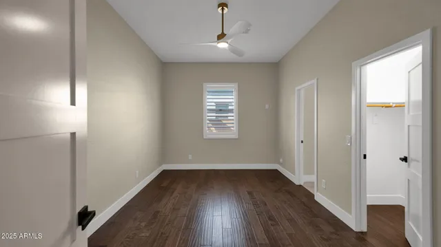 an aerial view of a house with swimming pool and porch