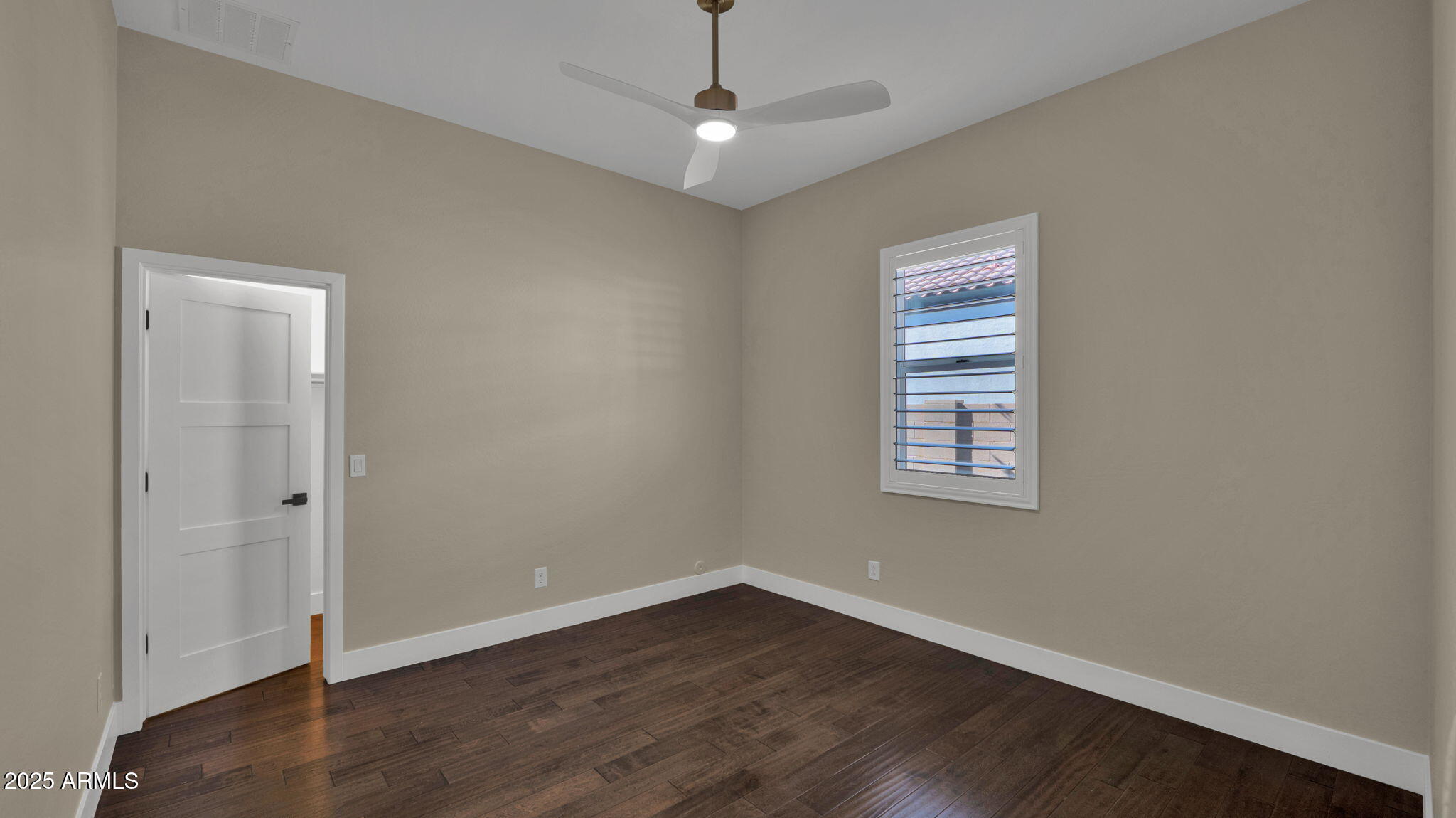 4060 East Canyon Way Chandler, AZ 85249 - Photo 39 of 55 wooden floor in an empty room with a window