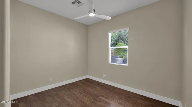 an aerial view of residential houses with outdoor space and street view