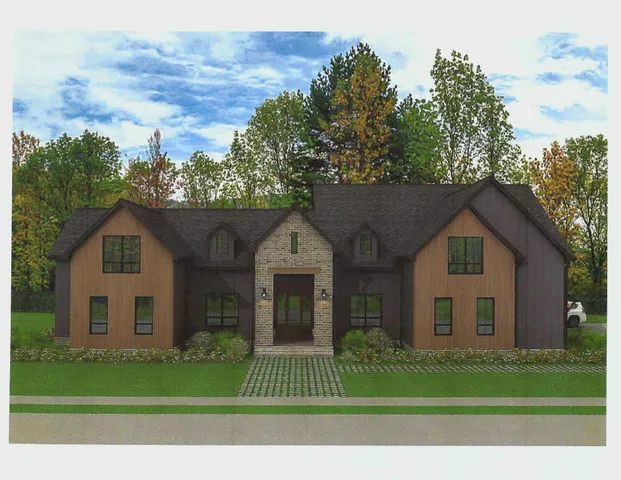 a front view of a house with a garden