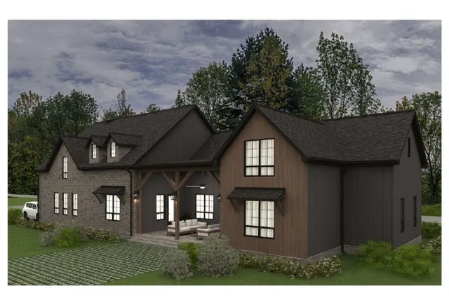 a front view of a house with a garden