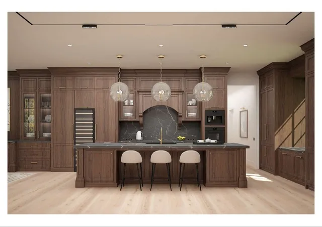 a kitchen with stainless steel appliances kitchen island a refrigerator and a wooden cabinets
