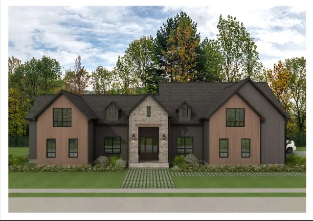 a front view of a house with a garden