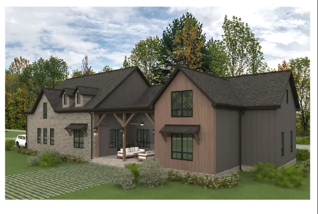 a view of a house with a yard and tree