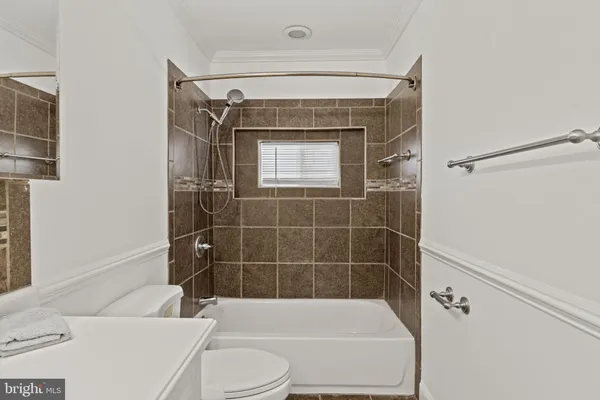 a view of a yard with wooden fence