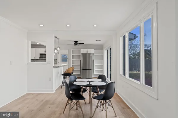a view of a dining room with furniture and window