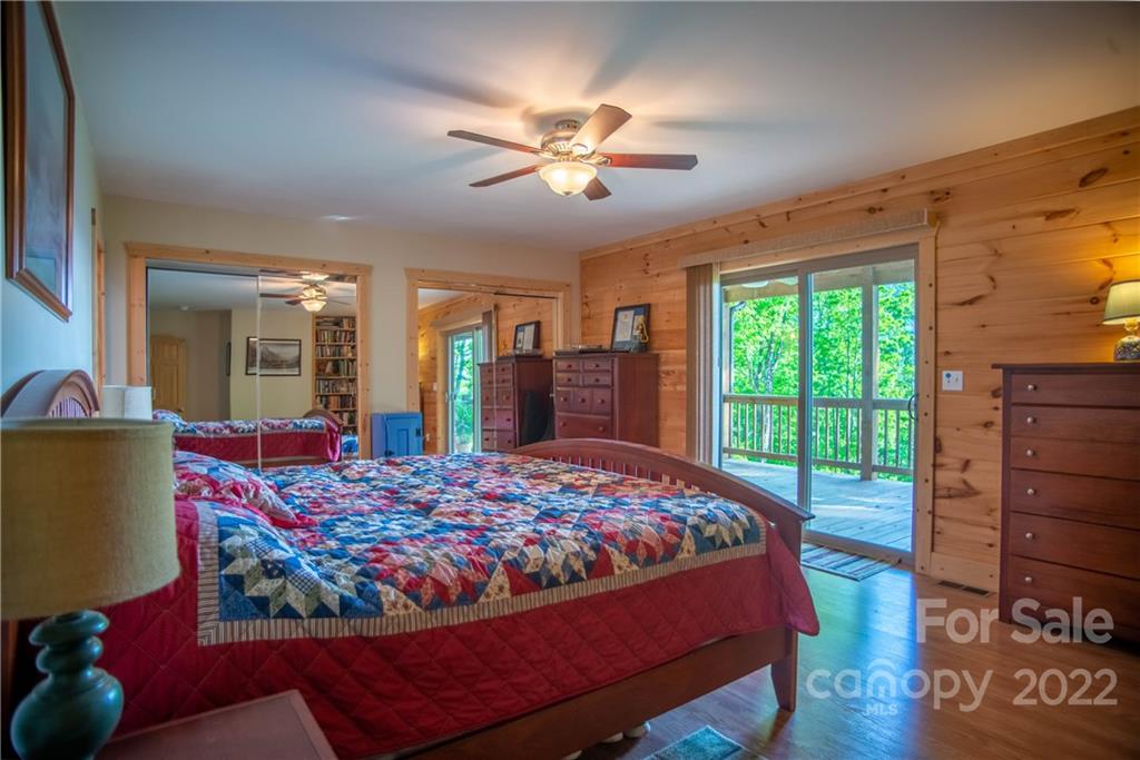 603 Wild Turkey Road Ferguson, NC 28624 - Photo 18 of 46 a bed sitting in a bedroom next to a window