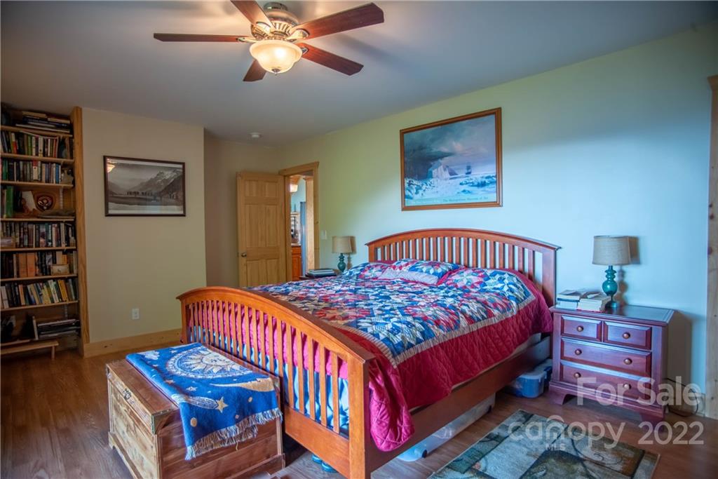 603 Wild Turkey Road Ferguson, NC 28624 - Photo 20 of 46 a bedroom with a bed and a dresser in it