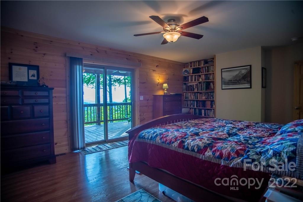 603 Wild Turkey Road Ferguson, NC 28624 - Photo 23 of 46 a bedroom with a bed and a bookshelf