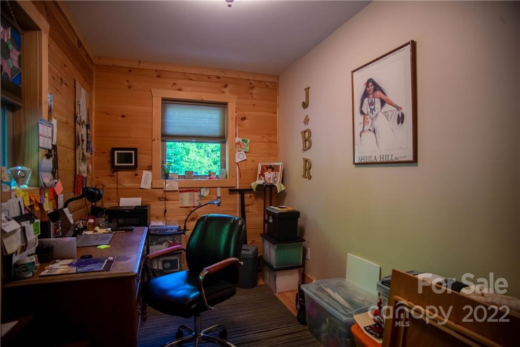603 Wild Turkey Road Ferguson, NC 28624 - Photo 27 of 46 a view of a workspace with furniture and a window