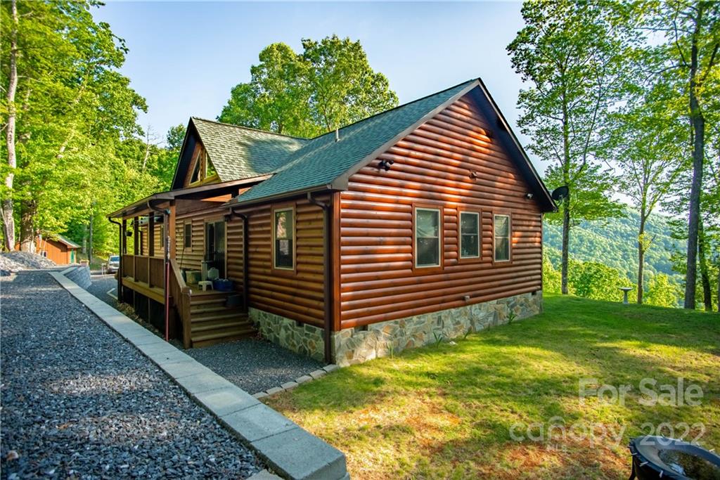 603 Wild Turkey Road Ferguson, NC 28624 - Photo 32 of 46 a view of a house with a yard