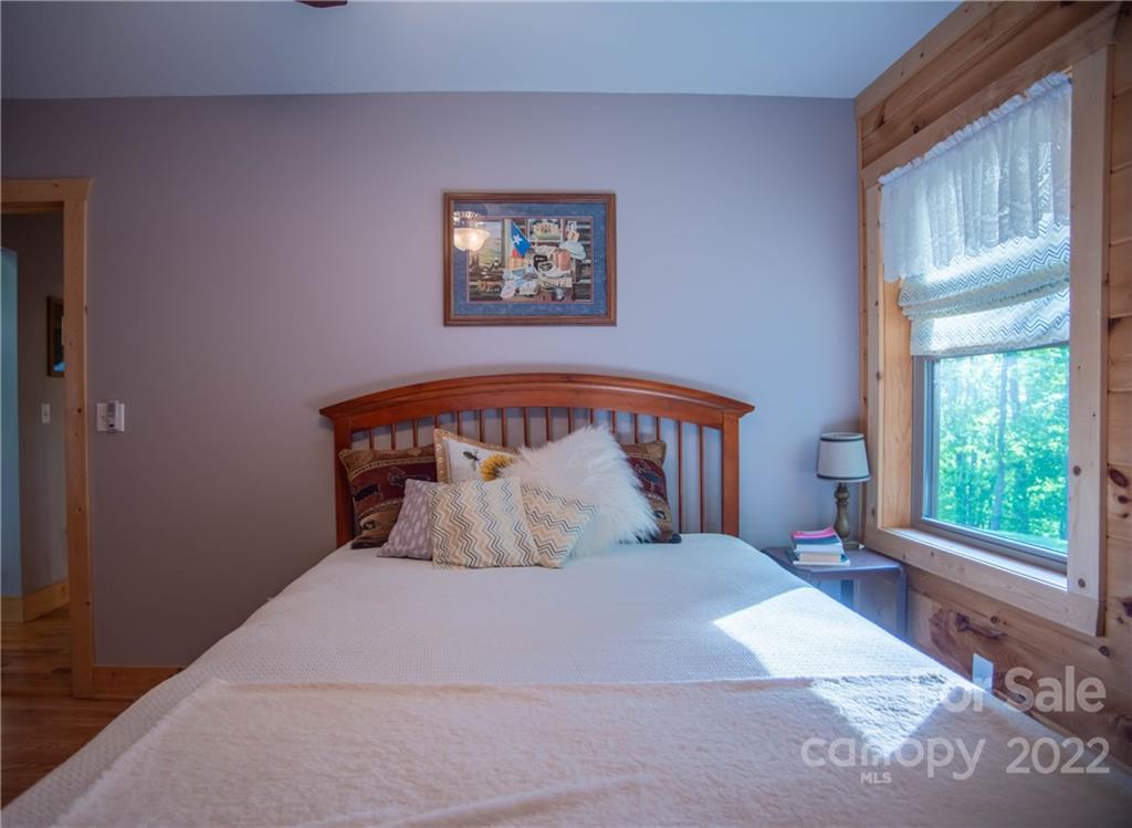 603 Wild Turkey Road Ferguson, NC 28624 - Photo 43 of 46 a bedroom with a large bed and a window