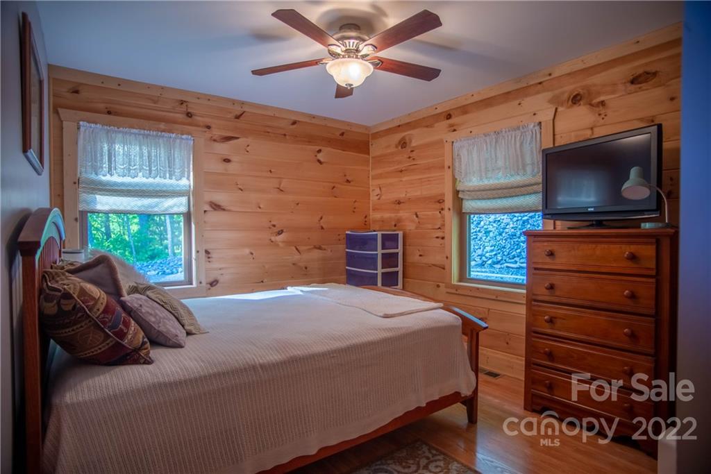 603 Wild Turkey Road Ferguson, NC 28624 - Photo 44 of 46 a bedroom with a bed and a television