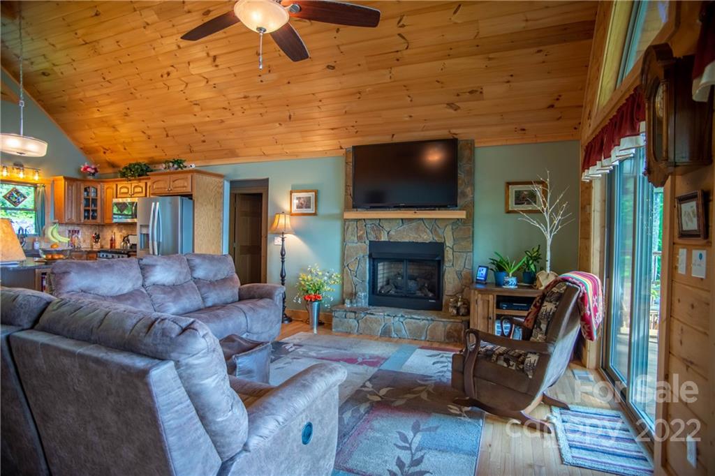 603 Wild Turkey Road Ferguson, NC 28624 - Photo 8 of 46 a living room with furniture and a fireplace