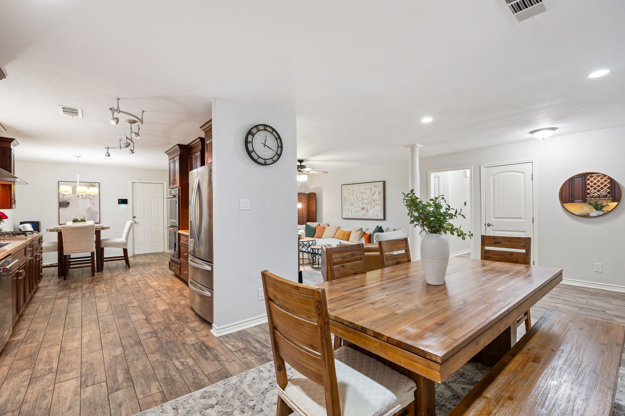 5658 Cartagena Street Houston, TX 77035 - Photo 9 of 33 The elegant dining room is open to the den and kitchen but is also it's own space.