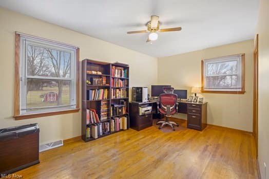 4618 South Arlington Road Uniontown, OH 44685 - Photo 27 of 31 Office space with a healthy amount of sunlight, ceiling fan, and light hardwood / wood-style flooring