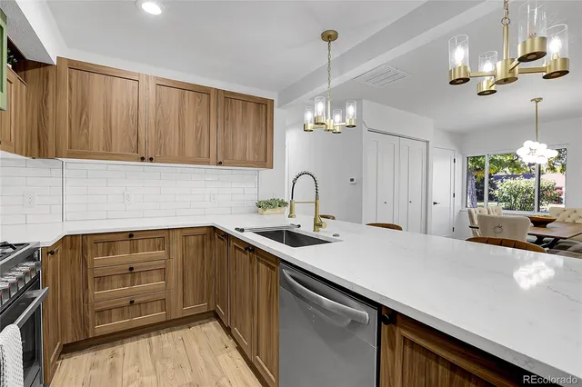 a kitchen with a sink and cabinets