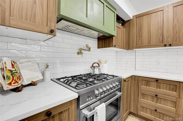 a kitchen with a stove and a sink