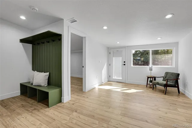 a view of a livingroom with furniture and wooden floor