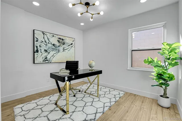 a view of a workspace with furniture