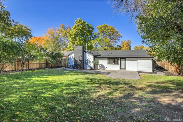 a front view of house with yard and outdoor seating