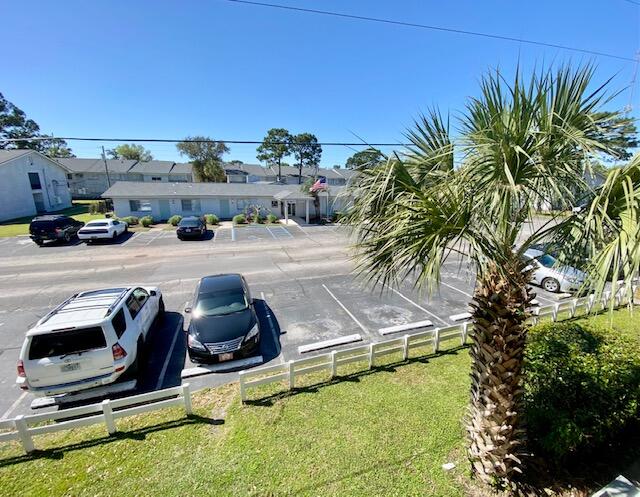 605 Colonial Drive, Unit 5 Fort Walton Beach, FL 32547 - Photo 20 of 31 a view of a swimming pool and lounge chair