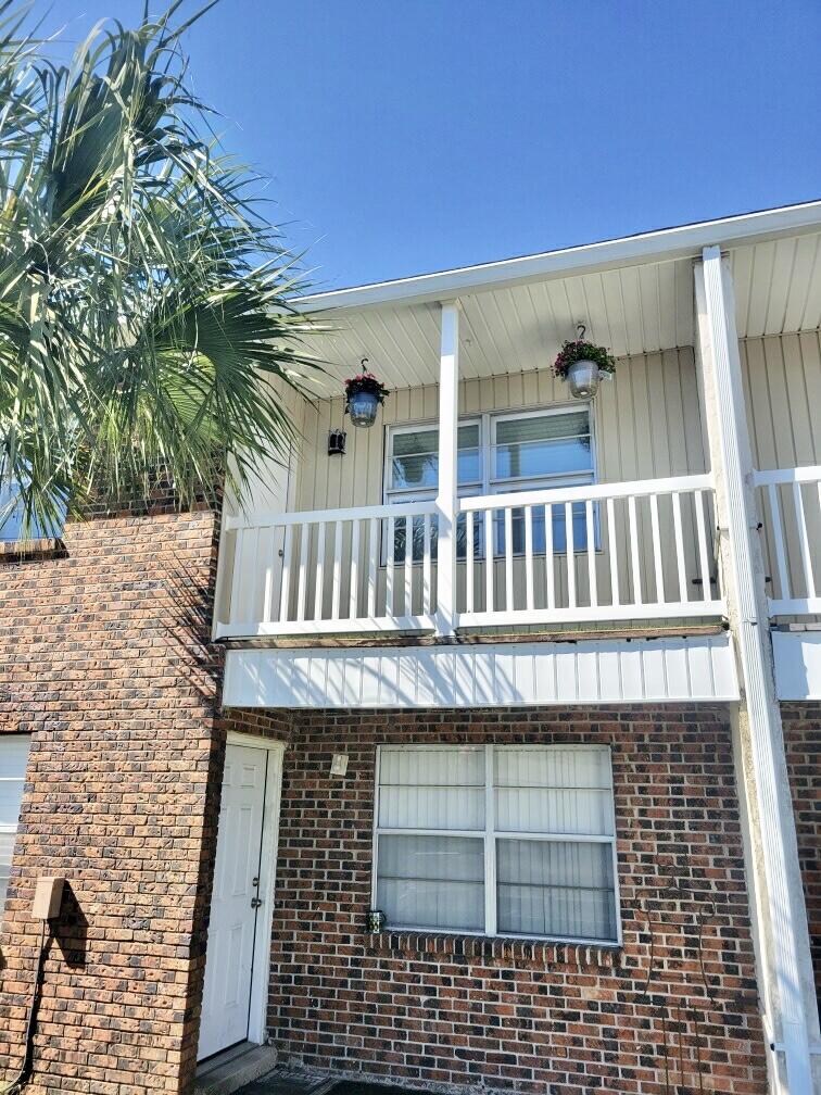 605 Colonial Drive, Unit 5 Fort Walton Beach, FL 32547 - Photo 21 of 31 a view of entryway with a garden