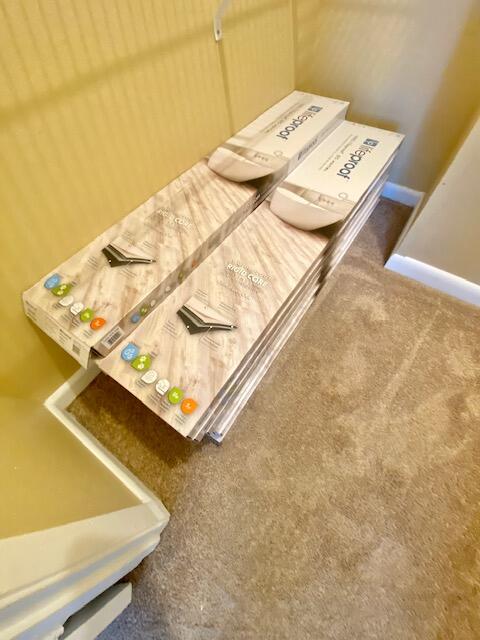 605 Colonial Drive, Unit 5 Fort Walton Beach, FL 32547 - Photo 23 of 31 a bedroom with a bed and a table