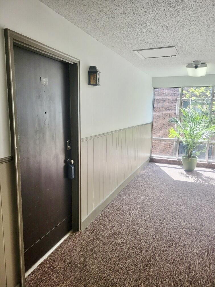 605 Colonial Drive, Unit 5 Fort Walton Beach, FL 32547 - Photo 3 of 31 an empty room with windows and entrance